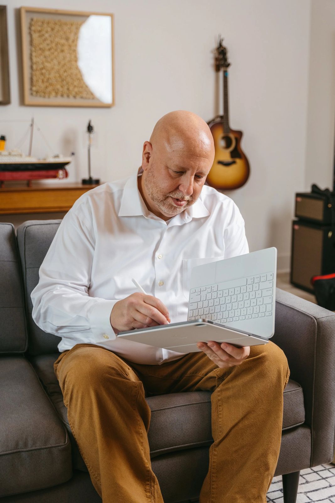 An agent seated with a notebook in a home office