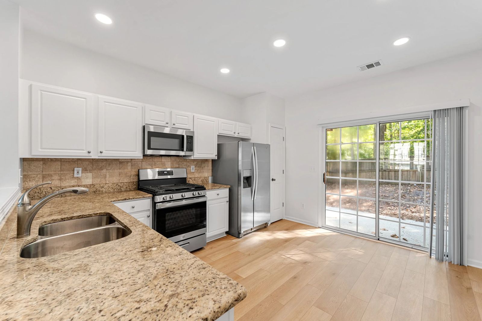 A kitchen with granite counters