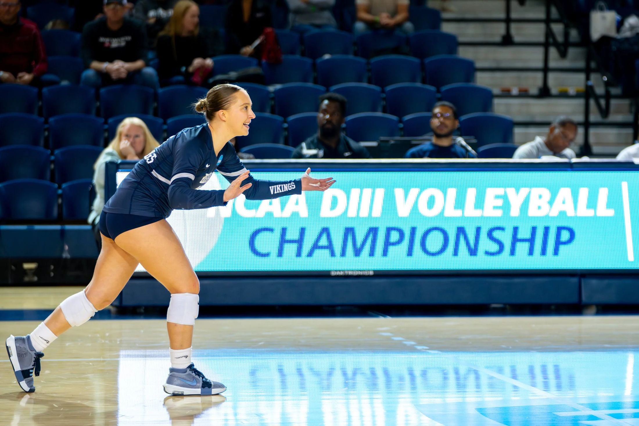 A player serving at the DIII championship