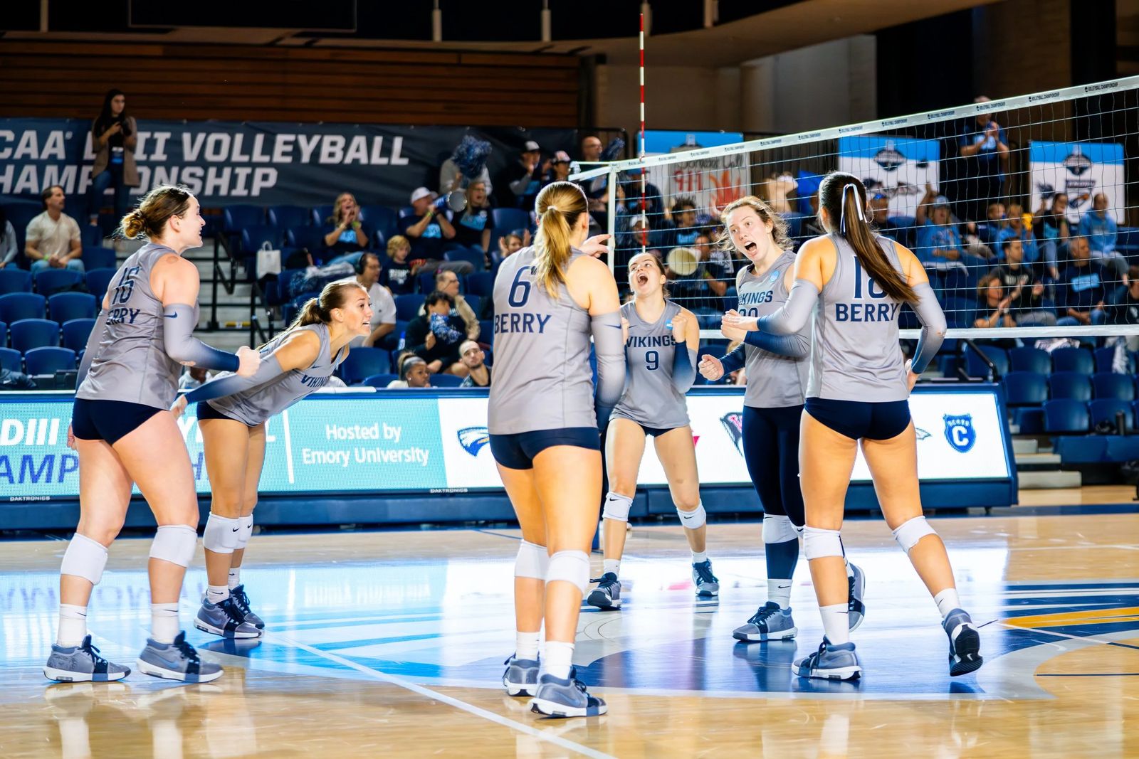 Volleyball players celebrating a point