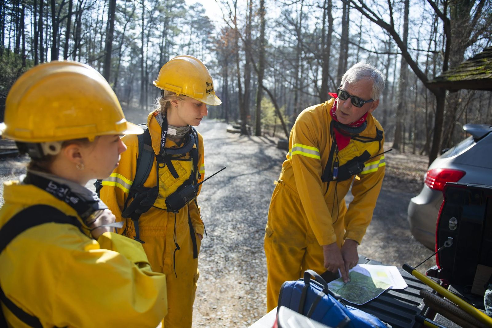 Firefighters reviewing a plan before a prescribed burn