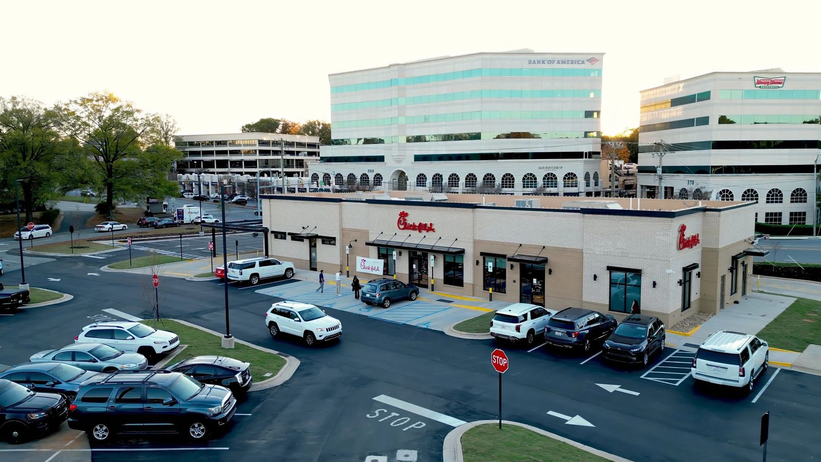 An aerial view of a commercial property and parking lot